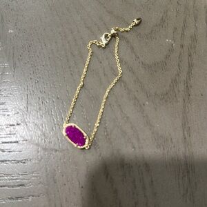 Beautiful  AUTHENTIC Kendra Scott bracelet. Gold and Purple Pendant.